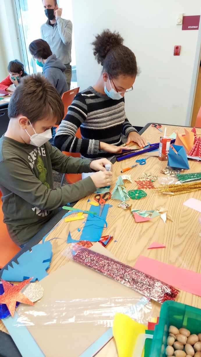 students working together on holiday crafts